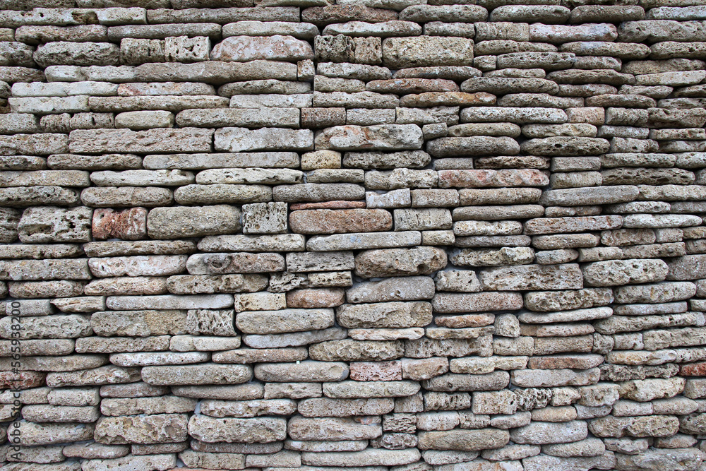 The wall is made of natural stone