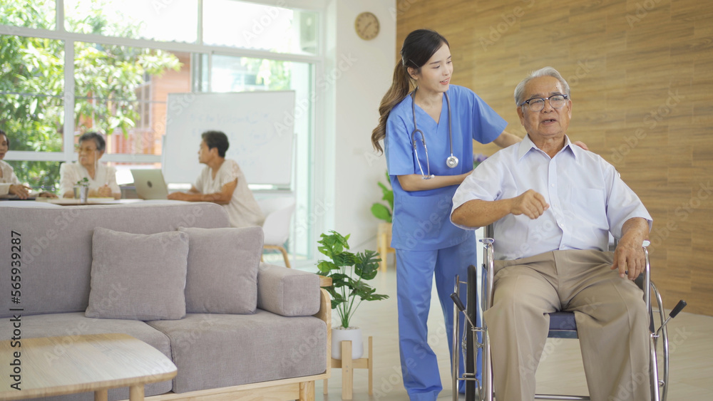 An Asian nurse talking to a group of old elderly patient or pensioner people smiling, relaxing, having fun together in nursing home. Senior lifestyle activity recreation. Retirement. Health care An Asian nurse talking to a group of old elderly patient or pensioner people smiling, relaxing, having fun together in nursing home. Senior lifestyle activity recreation. Retirement. Health care
