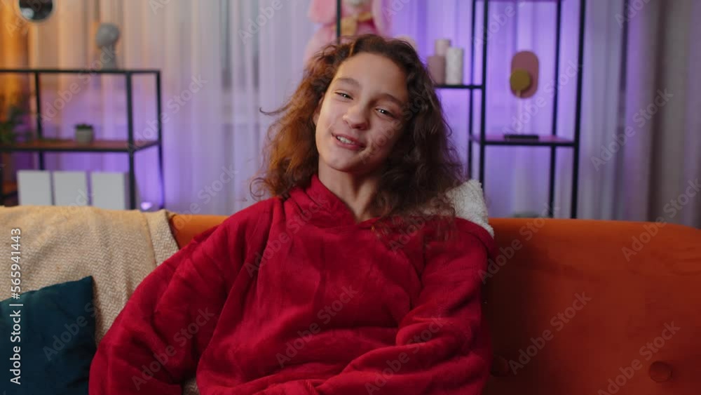 Happy calm young preteen girl child kid 12 years old smiling friendly, glad expression looking away dreaming resting, relaxation feel satisfied concept good news on couch. Teenager children at home Happy calm young preteen girl child kid 12 years old smiling friendly, glad expression looking away dreaming resting, relaxation feel satisfied concept good news on couch. Teenager children at home