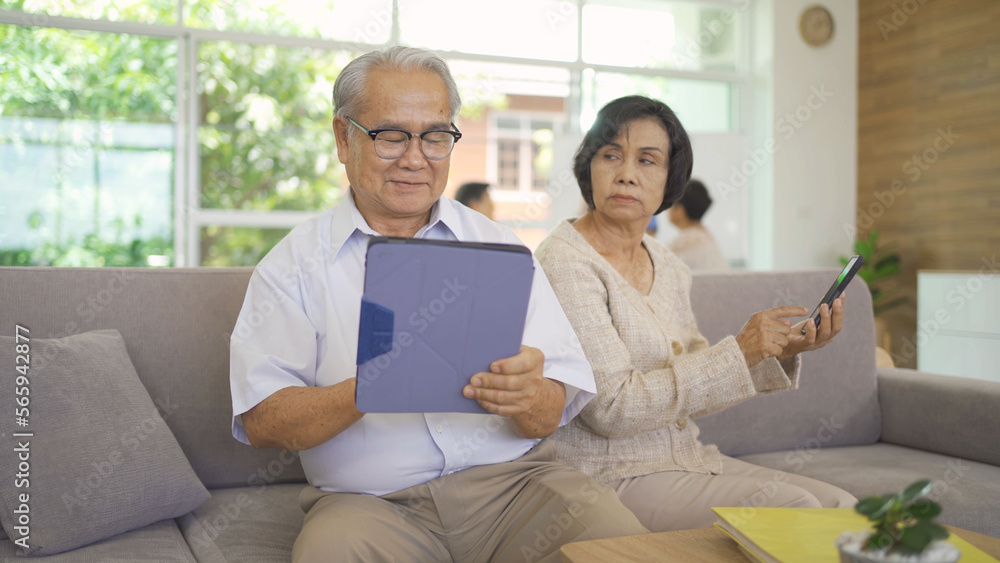Frustrated angry Asian couple dissatisfied or fight with her technology device, couple senior elderly patient person in nursing home in medical healthcare. People lifestyle. Family wife and husband Frustrated angry Asian couple dissatisfied or fight with her technology device, couple senior elderly patient person in nursing home in medical healthcare. People lifestyle. Family wife and husband