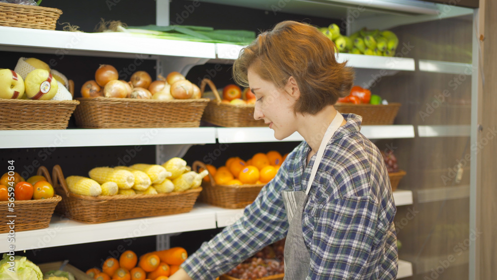 Portrait of a caucasian woman working in a supermarket or retail shop and food on grocery products. Food shopping. People lifestyle. Business service. A staff worker