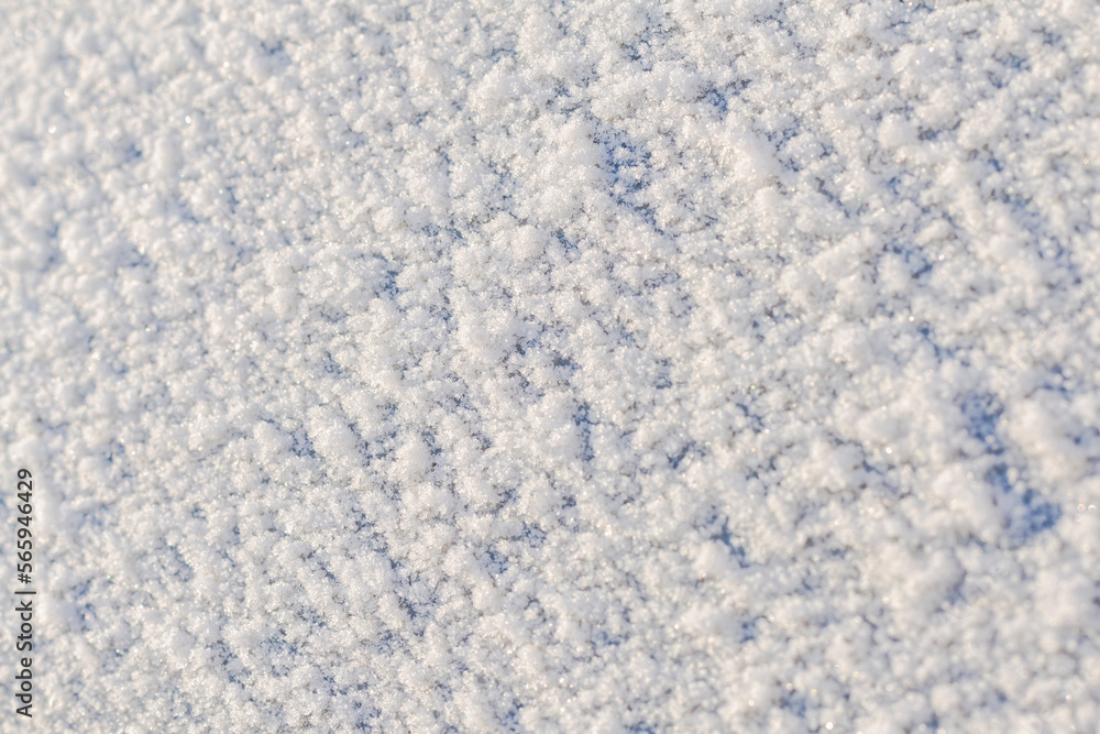 Window covered with snow,selective focus,copy space.Fractional snow texture,frozen precipitation.