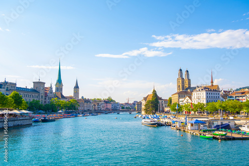 Obraz na płótnie Scenic panoramic view of historic Zürich city center with famous Fraumünster and Grossmünster Church and river Limmat at Lake Zurich on a beautiful sunny day with blue sky in summer, Switzerland w salonie
