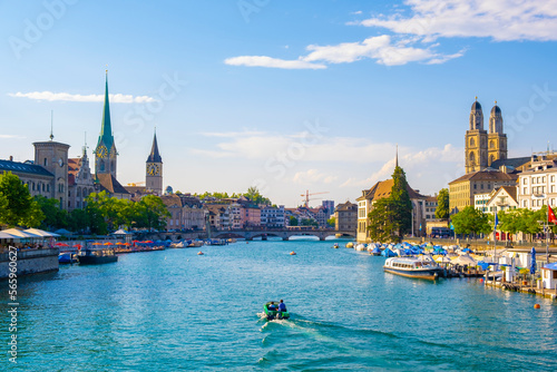 Obraz na płótnie Scenic panoramic view of historic Zürich city center with famous Fraumünster and Grossmünster Church and river Limmat at Lake Zurich on a beautiful sunny day with blue sky in summer, Switzerland w salonie