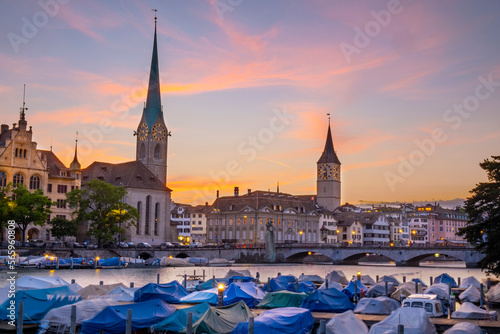 Scenic panoramic view of historic Zürich city center with famous Fraumünster and Grossmünster Church and river Limmat at Lake Zurich on a beautiful sunny day with blue sky in summer, Switzerland