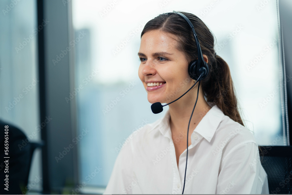 Female sales representative on the phone wearing wireless headset to work customer care and service Support office, talk and consult with customers Professional service center. Female sales representative on the phone wearing wireless headset to work customer care and service Support office, talk and consult with customers Professional service center.
