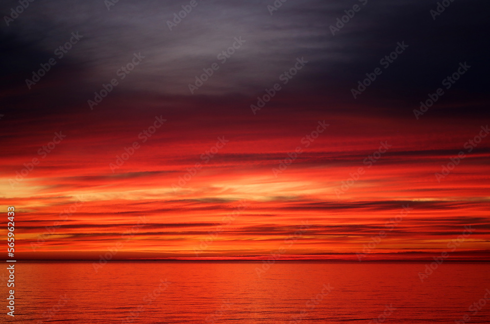 Photo of a bright red sunset on the Black Sea