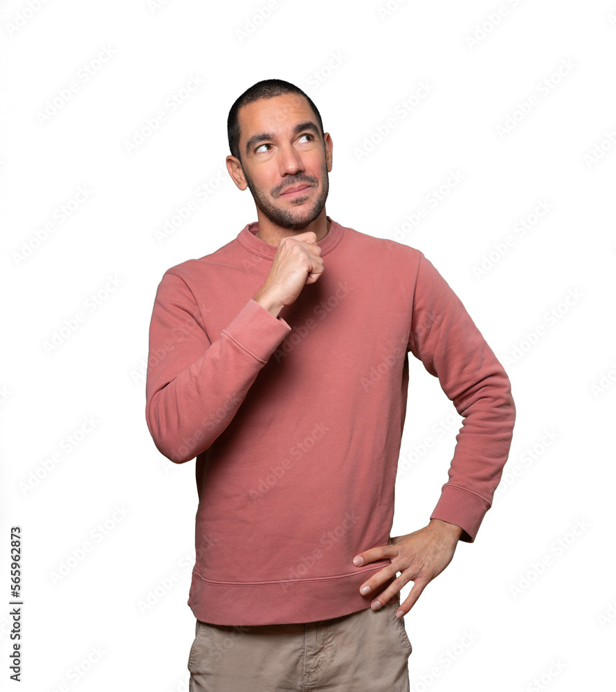 Surprised young man making a gesture of doubt Surprised young man making a gesture of doubt