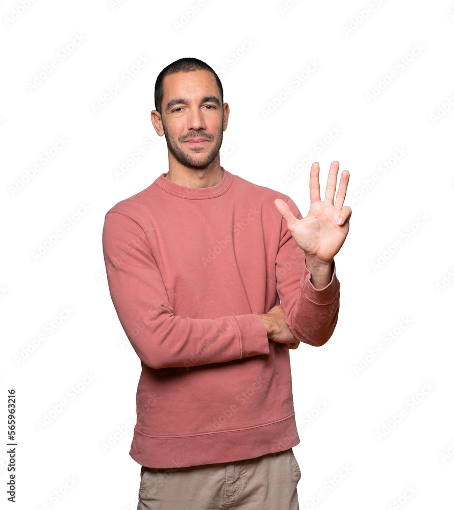 Young man making a number four gesture Young man making a number four gesture