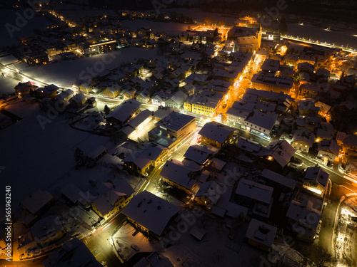 Aerial View of the small town Kuchl at night in Winter near Salzburg  Austria