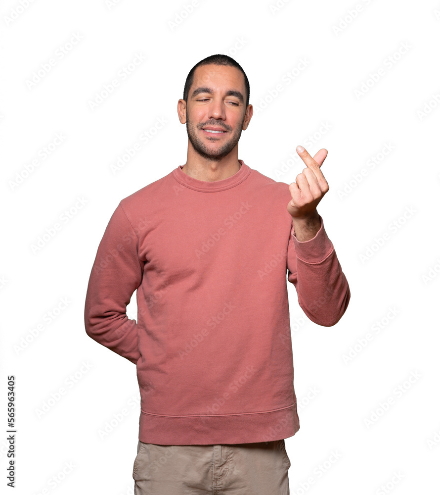 Young man making a gesture of worried about his economy Young man making a gesture of worried about his economy