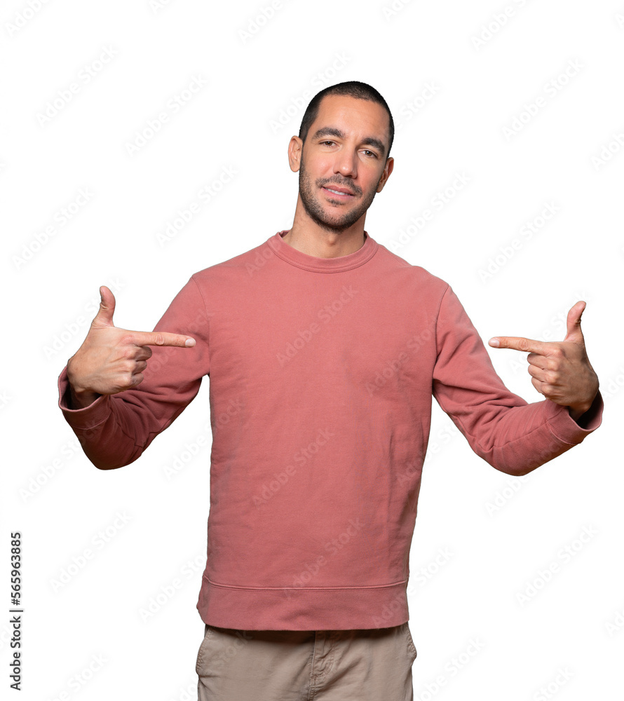 Cool young man pointing to himself Cool young man pointing to himself