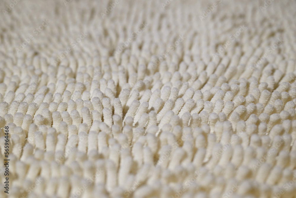 Bath mat close-up. The texture of the carpet with a long and fluffy pile. Shallow depth of field. Bath mat close-up. The texture of the carpet with a long and fluffy pile. Shallow depth of field.