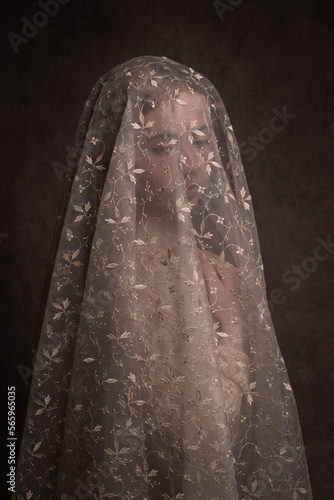 painterly dark pure renaissance portrait of blonde girl inspired by statue of mary photo
