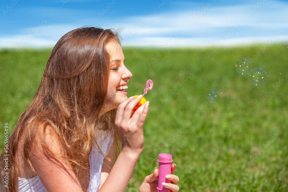 happy girl with soap bubbles in nature happy girl with soap bubbles in nature
