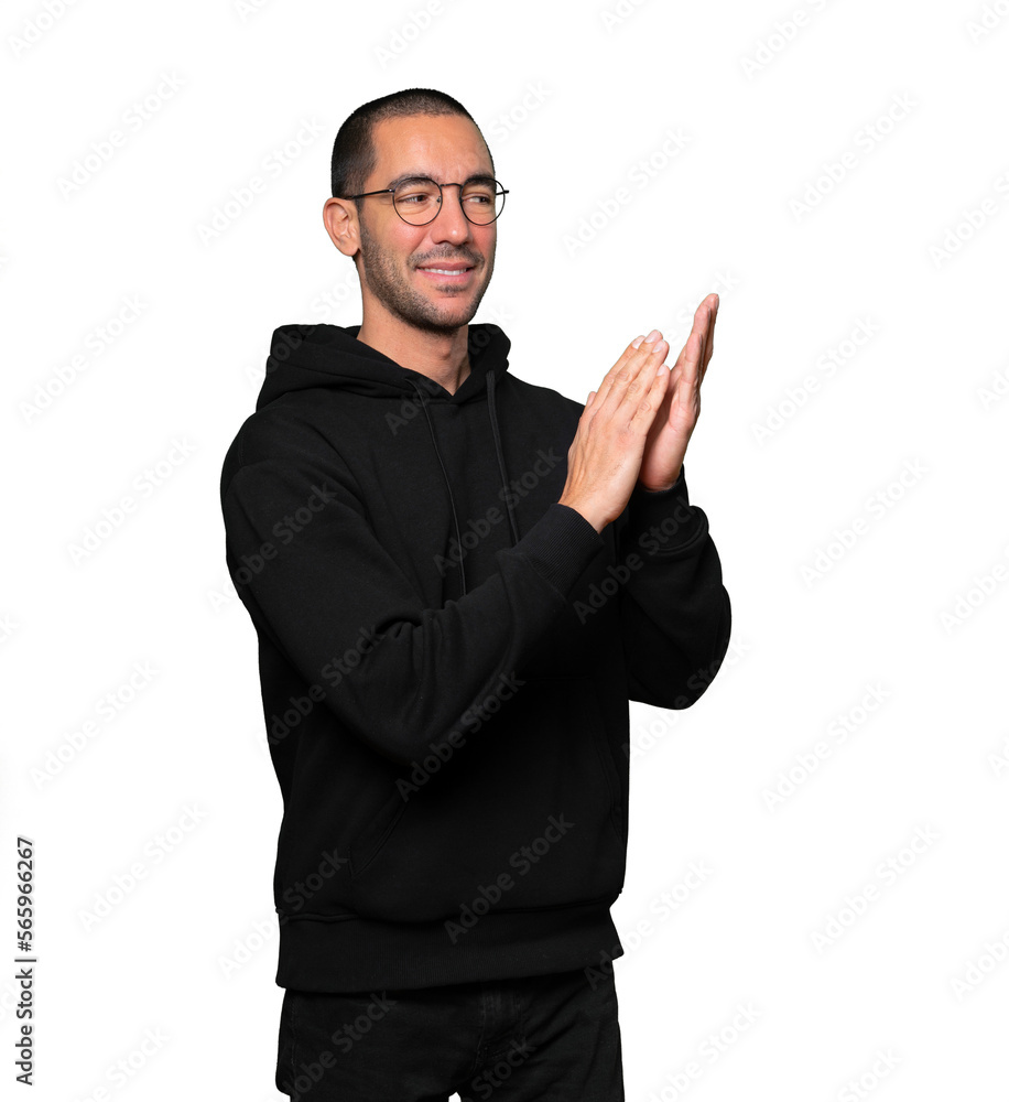 Kind young man doing an applauding gesture Kind young man doing an applauding gesture