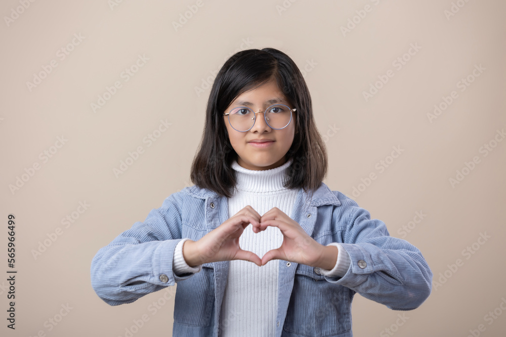 Mexican young girl making heart with hands, self love, women's rights Mexican young girl making heart with hands, self love, women's rights