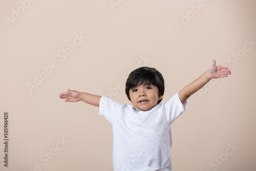 Happy Mexican little boy arms wide open