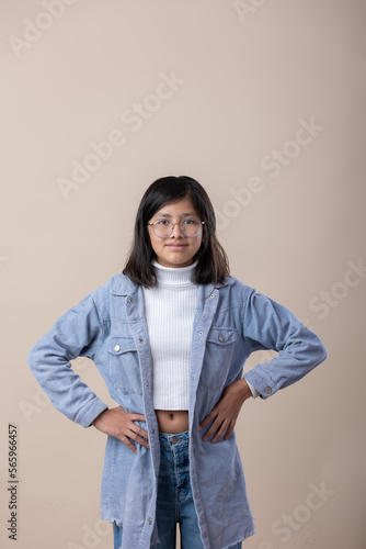 Portrait of a Mexican young girl blue jacket