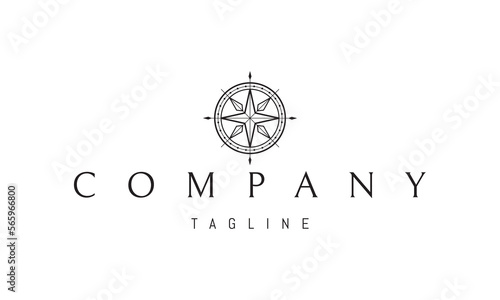 Vector logo on which an abstract image of a ships steering wheel in the form of a compass.