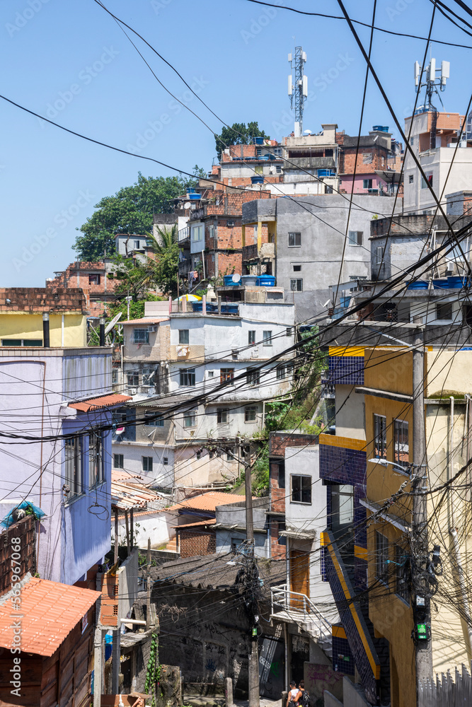 Beautiful view to poor favela houses on hill side and power lines