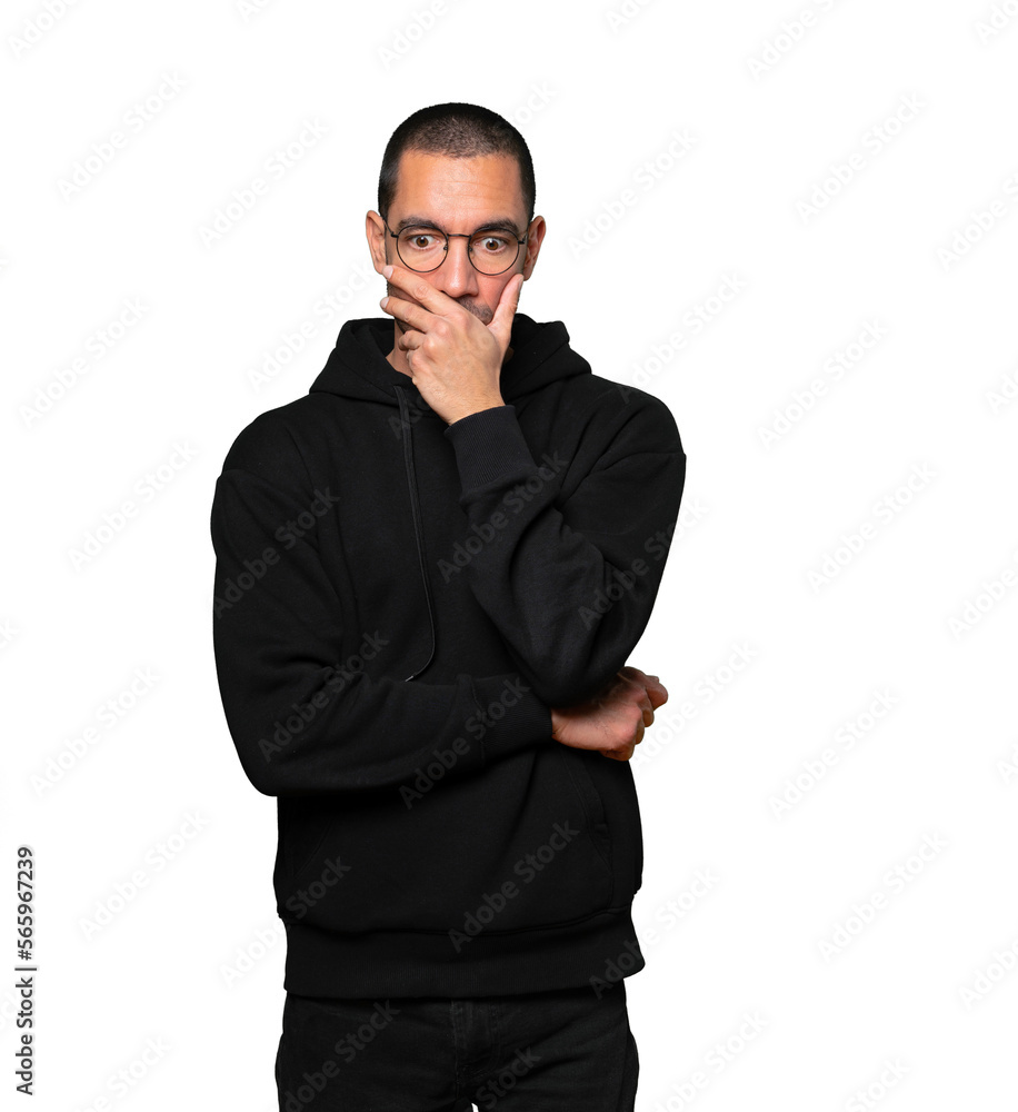 Concerned young man posing against background Concerned young man posing against background