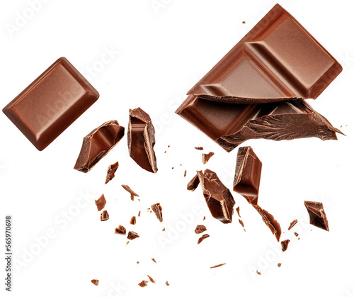  Levitating milk chocolate chunks isolated on white background. Flying Chocolate pieces, shavings and cocoa crumbs Top view. Flat lay.
