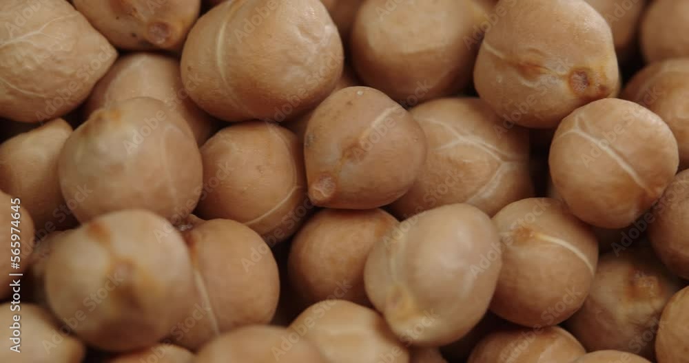 Raw chickpeas, rotation. Chickpeas, close-up dolly shot. Macro footage of chickpeas beans. Food cooking video. Raw chickpeas, rotation. Chickpeas, close-up dolly shot. Macro footage of chickpeas beans. Food cooking video.