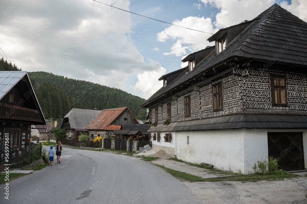 Street and old wooden buildings in Cicmany , Slovakia