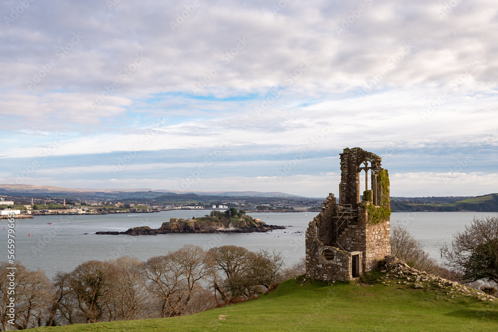 View across Plymouth Sound from Mount Edgecombe country park with Drake's Island in the foreground.