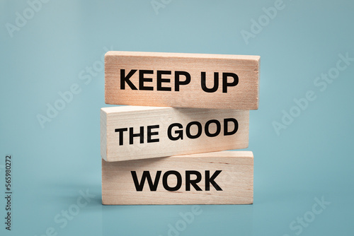 Keep up the good work, text is written on wooden blocks, Business concept, Motivating slogan, work commitment