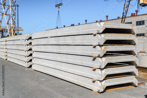Canvas Print Stack of new reinforced concrete slabs covering industrial buildings