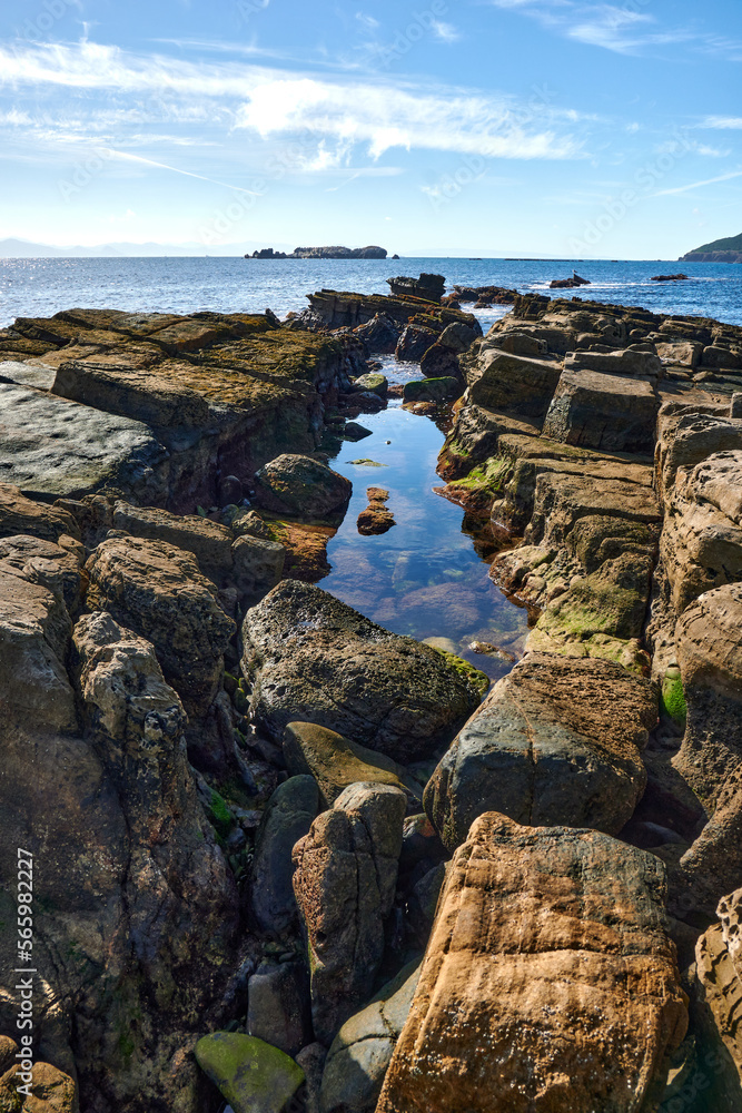 vertical shot of a beautiful rocky seascape in Cadiz, Spain