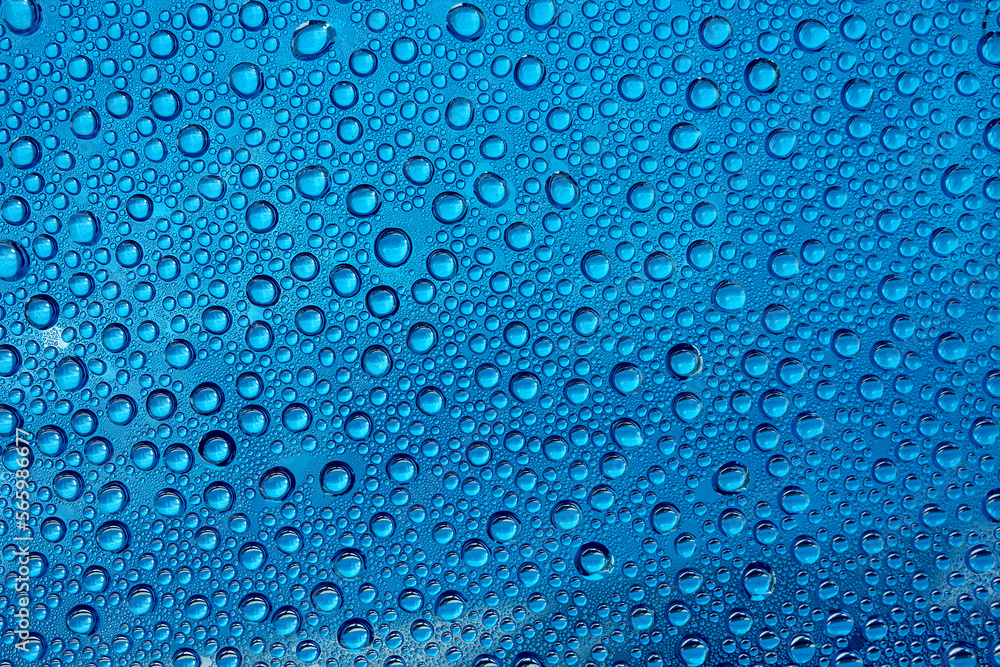 background image horizontally many drops on glass in blue