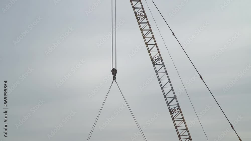 Engineer foreman discussion work control to highway construction working in site with a crane lifting the big concrete segment Engineer foreman discussion work control to highway construction working in site with a crane lifting the big concrete segment