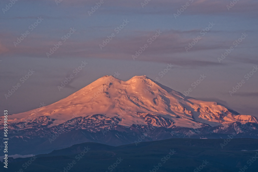 Elbrus mount in the morning light. Elbrus mount is the highest mountain peak in Russia and Europe. Morning sunrise mountain landscape.
