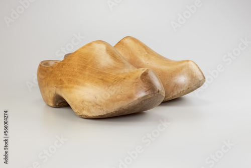 Obraz na plátně Pair of vintage wooden Dutch clogs in studio