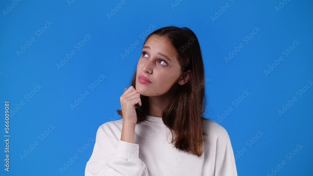 4k video of one girl thinking about something with a pen in hand. 4k video of one girl thinking about something with a pen in hand.