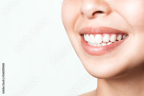 Asian female smile after teeth whitening procedure. Dental care. Dentistry concept.