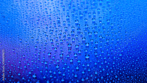 Water drops. Abstract gradient backdrop. Drop texture. Blue gradient. Highly textured image. Shallow depth of field. Selective focus
