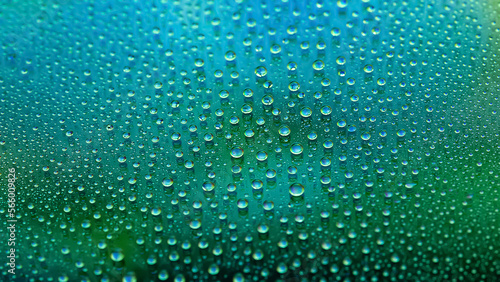 Water drops. Abstract gradient background. The texture of the drops. Green gradient. Textured image. Small depth of field. Selective focus