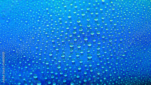 Water drops. Abstract gradient backdrop. Drop texture. Blue gradient. Heavily textured image. Small depth of field. Selective focus