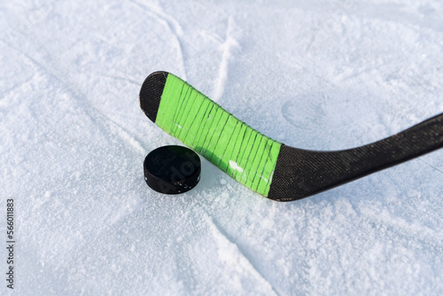 children's hockey stick rewound with electrical tape. hockey game. hitting the puck
