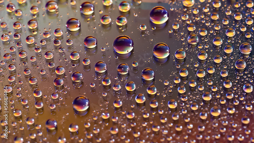 Water drops. Texture of the drops. Abstract gradient background. Golden rainbow gradient. Heavily textured image. Shallow depth of field. Selective focus
