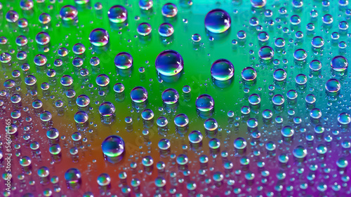 Water drops. Abstract gradient background. Droplet texture. Iridescent gradient. A highly textured image. Shallow depth of field. Selective focus