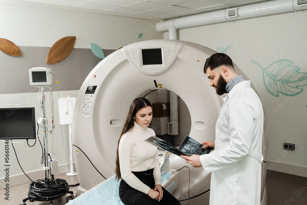 Consultation about spine CT scan for assess for herniated disk, tumors, extent of injuries, blood vessel malformations. Computed tomography CT scan process for examination of spine. Consultation about spine CT scan for assess for herniated disk, tumors, extent of injuries, blood vessel malformations. Computed tomography CT scan process for examination of spine.