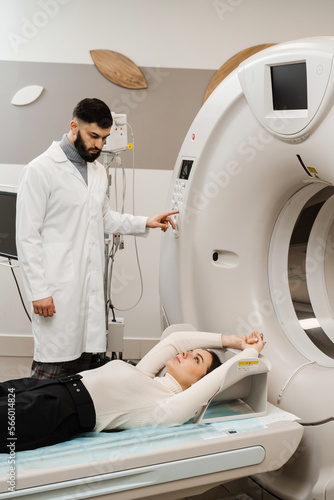 CT scan of abdomen of girl in medical clinic. Woman patient is doing computed tomography x-ray scan chest examination of abdominal in a CT scan room.