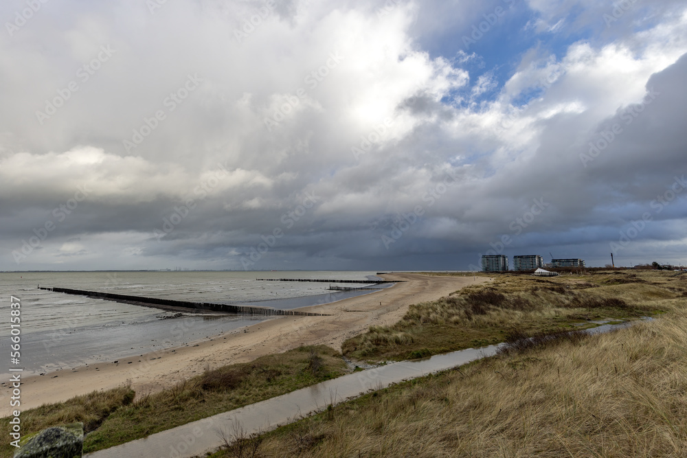 Beautiful sea view with wave breakers on the beach of Breskens, Zeeland, The Netherlands