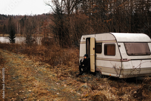 a man drove into the forest to rest in his trailer © Irina