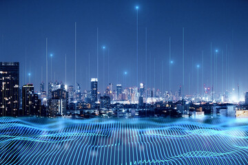 Smart city and big data connection technology concept with digital blue wavy wires with antennas on night megapolis city skyline background, double exposure